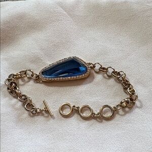Elegant Gold Bracelet with Sapphire Blue Stone